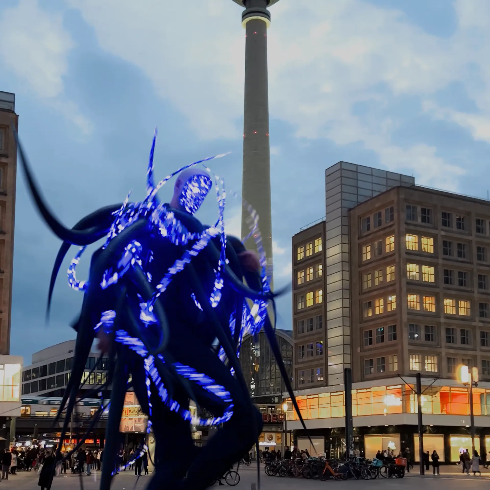 Mixed reality visual for Fritz Kalkbrenner’s Playing Games, featuring a glowing 3D character composited into live-action footage at Alexanderplatz, Berlin